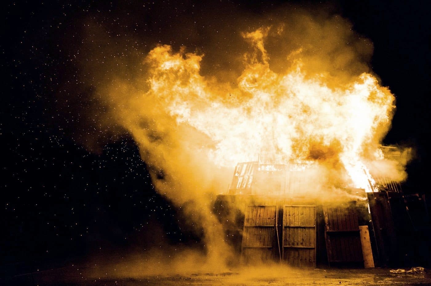 A building alight at night during a serious fire